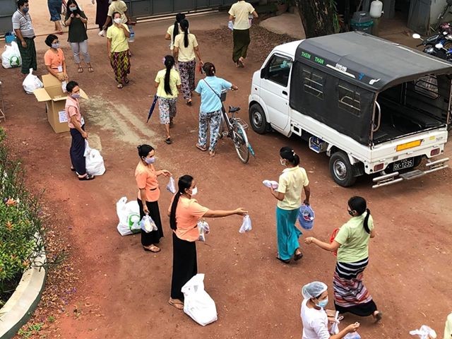 Business Kind Myanmar, CARE’s partner, distributes soap, sanitizer and masks to women migrants at a garment factory in peri-urban Yangon. Photo | @Asia Vista Garment Factory