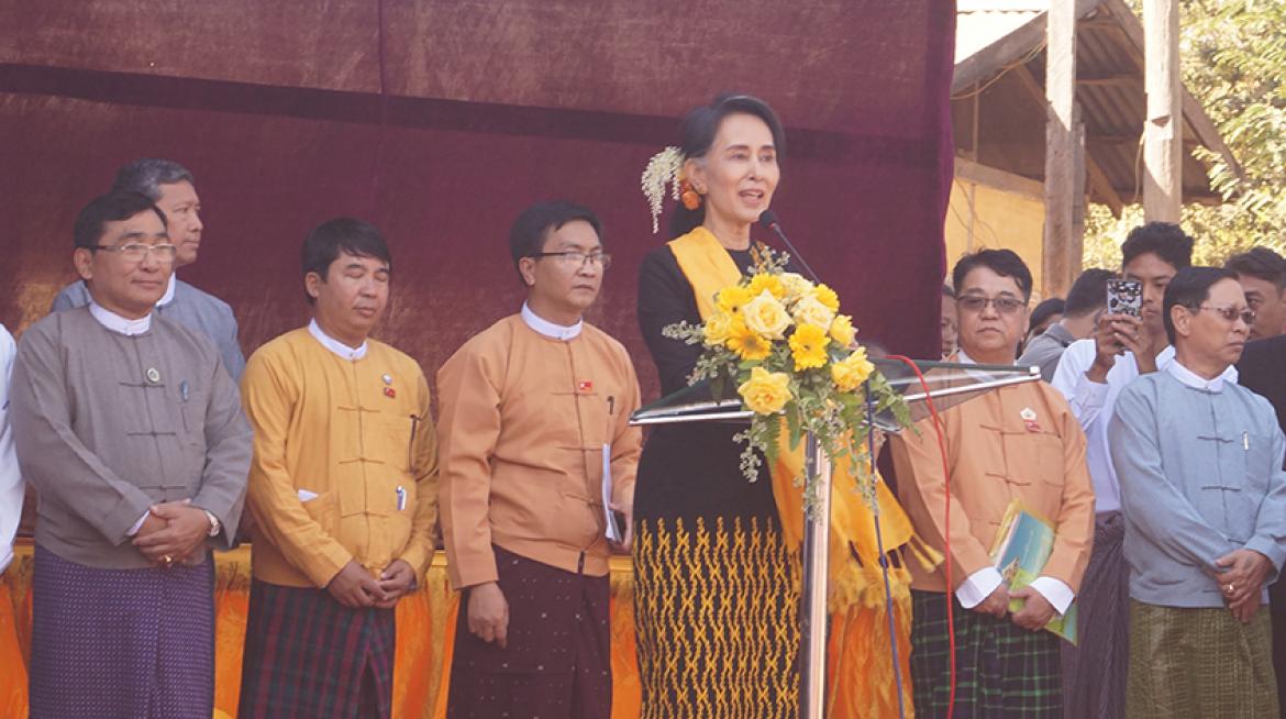 DASSK laughs with her ministers at village townhall meeting