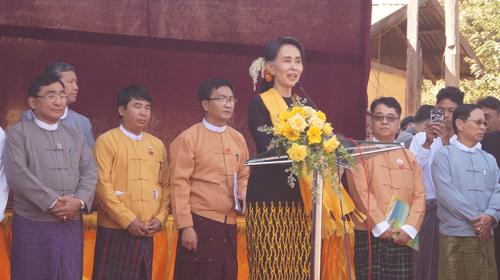 DASSK laughs with her ministers at village townhall meeting